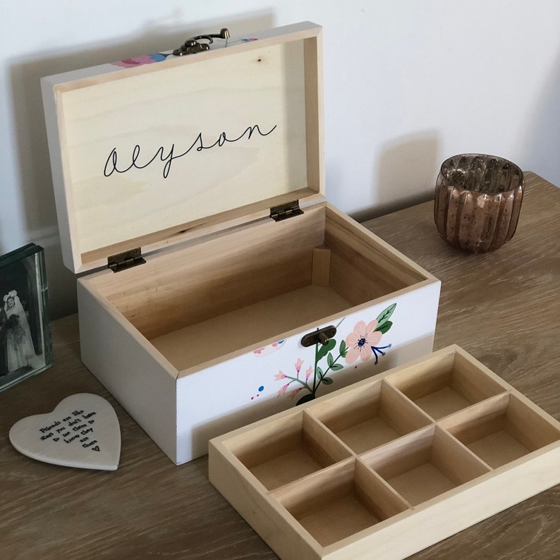 Handpainted wooden jewelleryjewelry box with a folk art design.