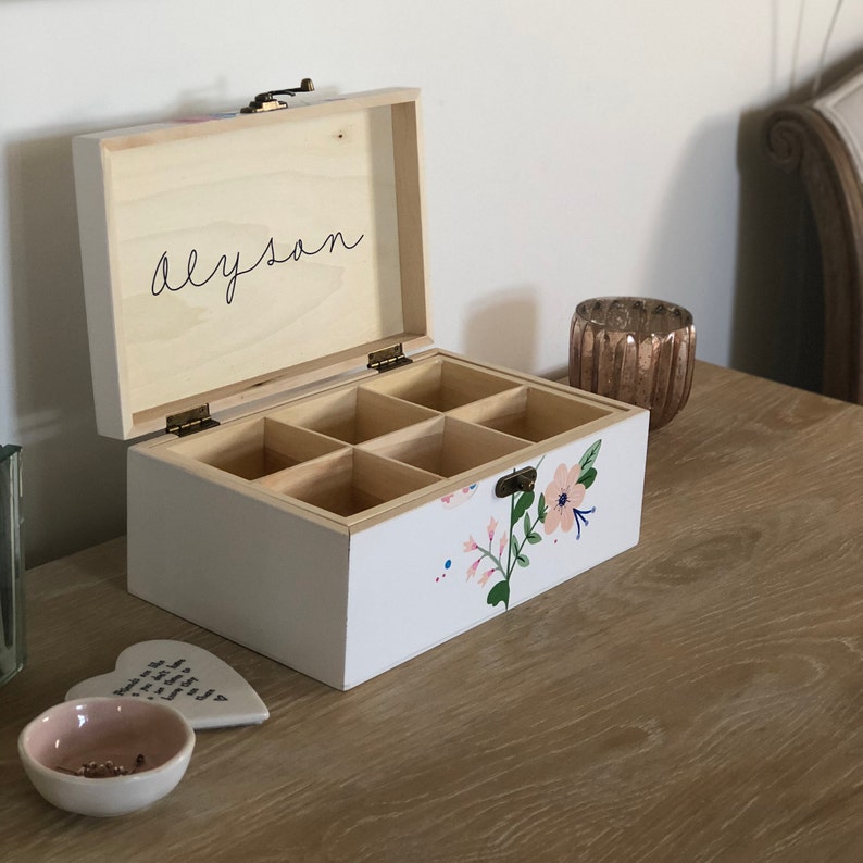 Handpainted wooden jewelleryjewelry box with a folk art design.