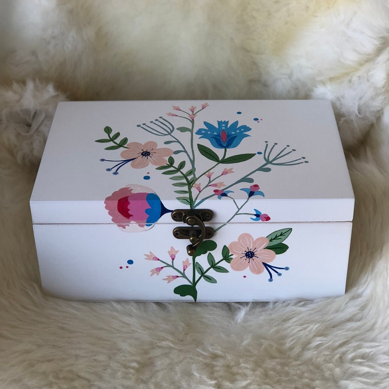 Handpainted wooden jewelleryjewelry box with a folk art design.