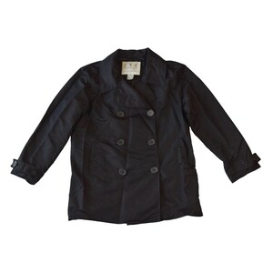 May include: A black double-breasted jacket with a notched collar and long sleeves. The jacket has six buttons and two front pockets. The label reads "INC International Concepts".