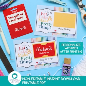 May include: Two printable birthday cards with the text Eat Cake & Make Pretty Things and Happy Birthday, featuring a slot for a red Michaels gift card. The cards are surrounded by craft supplies including scissors, embroidery floss, and paint.