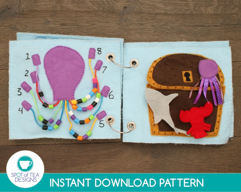 May include: A felt book with a purple octopus on the left page and a brown treasure chest with a shark and lobster on the right page. The octopus has eight tentacles with colorful beads on each one. The numbers 1 through 8 are written on the page next to each tentacle. The treasure chest has a keyhole and a purple octopus with pink tentacles coming out of the top.