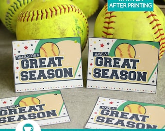 May include: Softball-themed printable cards with the text "Thanks for a Great Season" and "Have a Great Season". The cards feature a baseball graphic and star accents. The image also includes several yellow softballs.
