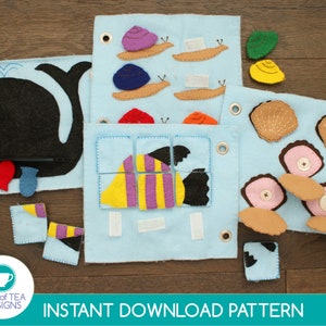 May include: A set of felt activity boards for children. The boards feature a whale, a fish, snails, and shells. The boards are designed to help children learn about different sea creatures and their habitats. The boards are made of felt and are easy to clean.  Instant Download Pattern.