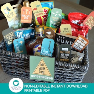 May include: A retirement gift basket filled with snacks, a bottle of liquor, and tags with retirement-themed phrases. The basket includes a sign that reads "No Work Zone" and the text "Happy Retirement!"
