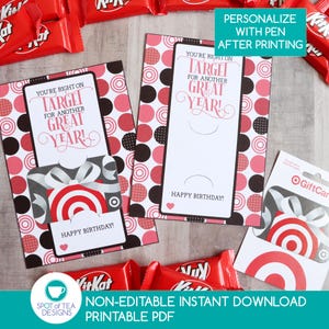 May include: Two rectangular birthday cards featuring a white center panel with the text YOU'RE RIGHT ON TARGET FOR ANOTHER GREAT YEAR! and HAPPY BIRTHDAY! surrounded by a black, pink, and white polka dot border with a red and white gift graphic.