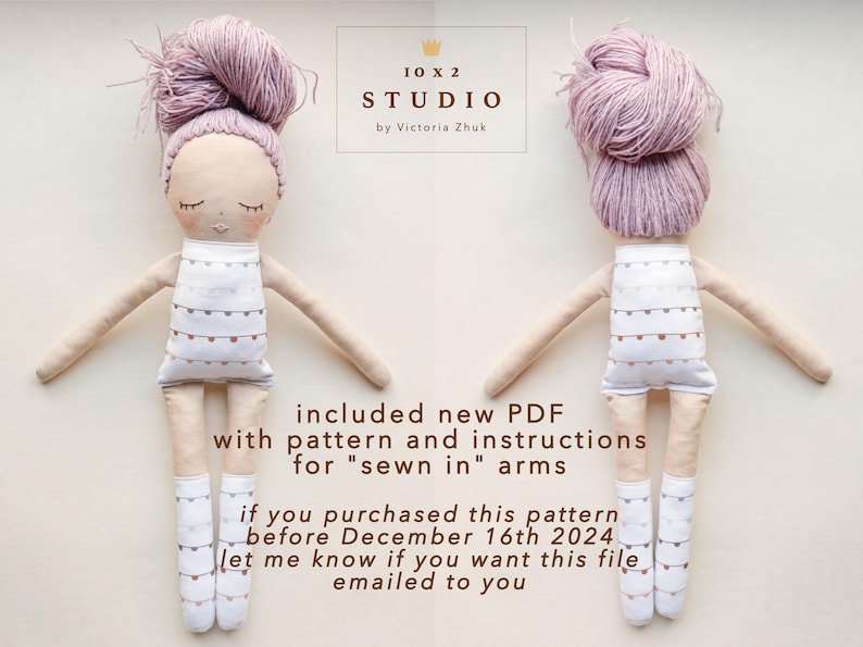 May include: Two handmade dolls with pink yarn hair and white dresses with brown accents. The dolls are facing opposite directions. The text "included new PDF with pattern and instructions for "sewn in" arms" is below the dolls. The text "if you purchased this pattern before December 16th 2024 let me know if you want this file emailed to you" is below the first line of text.
