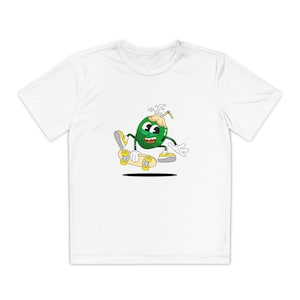 May include: White t-shirt featuring a cartoon coconut character skateboarding. The coconut is green with a smiling face, wearing yellow shoes, and holding a yellow skateboard. A straw is in the coconut. The design is centered on the shirt.