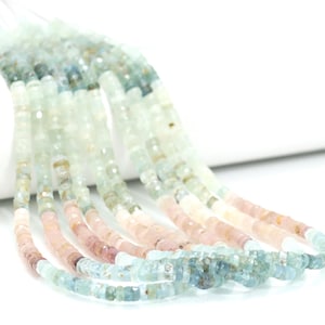 May include: A strand of light blue, pink, and white gemstone beads. The beads are faceted and have a slightly irregular shape. The strand is approximately 18 inches (46 cm) long.