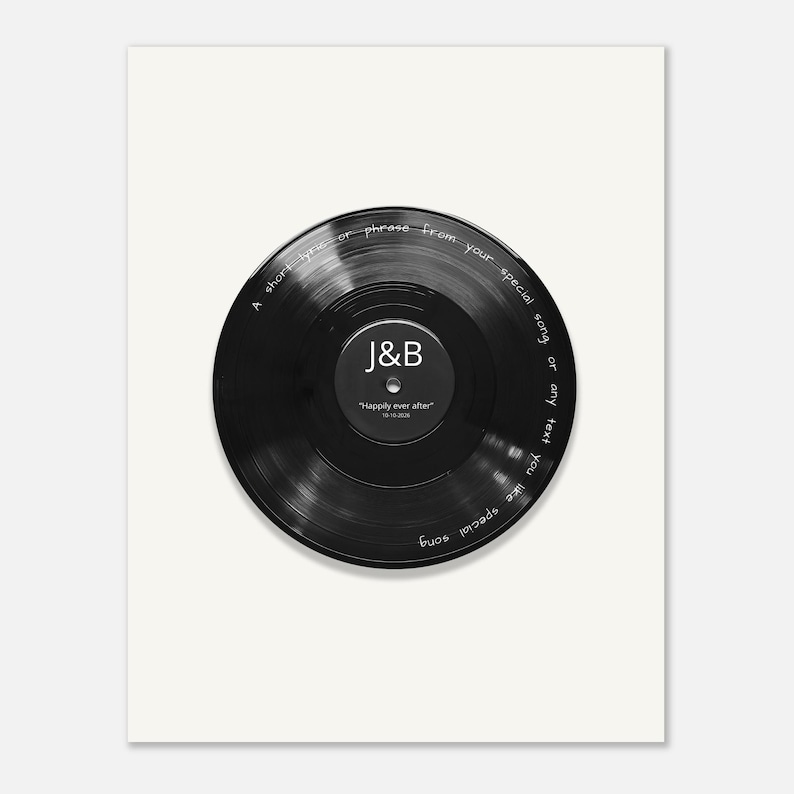 May include: A black vinyl record print featuring white text along the outer edge that reads A short lyric or phrase from your special song or any text you like special song. The center label displays the letters J&B and Happily ever after 10-10-2020.