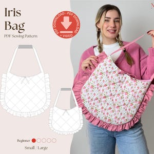 May include: A PDF sewing pattern for the Iris Bag, featuring a quilted white fabric with a pink strawberry print, a ruffled edge, and a single shoulder strap. The design includes a small and large size option, beginner difficulty, and a video tutorial.