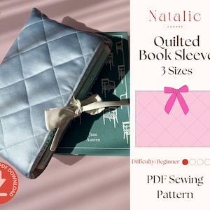 May include: A light blue quilted book sleeve with a diamond pattern, tied with a cream-colored bow, protecting a book. The image also shows a pink illustration of a book sleeve with a pink bow and the text "Quilted Book Sleeve 3 Sizes".
