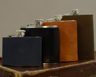 stainless steel and leather hip flask with suede case