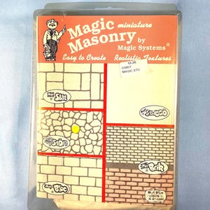 May include: A set of four Magic Masonry miniature texture stamps for creating realistic brick, stone, slat, and stucco textures. The stamps are packaged in a clear plastic case with a red and white label that reads "Magic Masonry by Magic Systems Easy to Create Realistic Textures 10.25 03807 MAGIC STO".