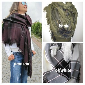 May include: Three plaid scarves with fringe edges in damson, khaki, and off-white colors.