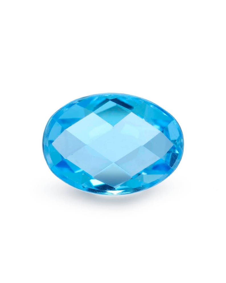 Approximately 7.77 Total Carat Weight. Natural 14x10mm Blue Topaz Oval Cabochon Checkerboard Cut