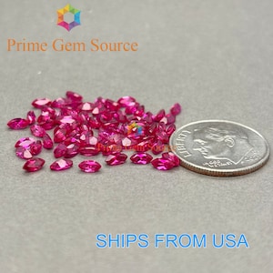 May include: A pile of small, pink, marquise-shaped gemstones next to a US dime coin.  SHIPS FROM USA.