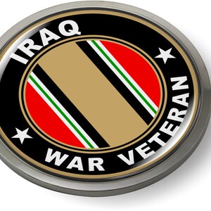 May include: A round, silver-colored pin with a black background and the words "IRAQ WAR VETERAN" in white lettering. The center of the pin features a stylized version of the Iraqi flag in gold, black, red, and green.