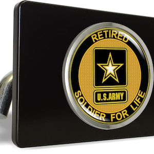 May include: Black hitch cover with a chrome and yellow circle emblem. The emblem says "Retired Soldier for Life" with a yellow star inside a black square and the words "U.S. Army".