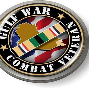 May include: A round, silver-colored Gulf War Combat Veteran commemorative coin. The coin features a black outer ring with white text, a gold star, and a colorful ribbon. The center displays a map and a flag design.