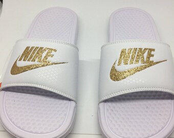 orange and white nike slides