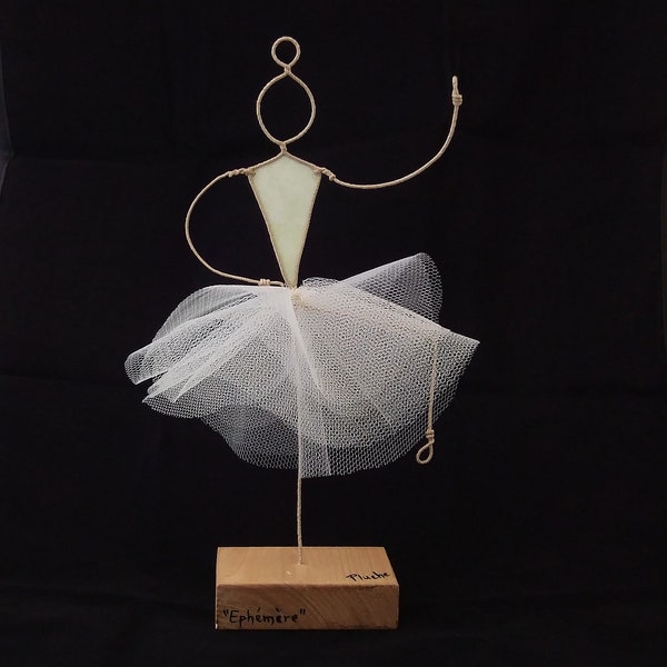 Modern sculpture in animated kraft twine and patterned paper, Dancer, paper sculpture and poetry