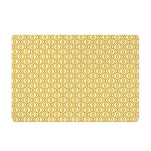 May include: A rectangular mat with a repeating retro pattern. The design features a series of interconnected, eye-shaped motifs in shades of yellow, orange, and white. The overall aesthetic is reminiscent of mid-century modern design.
