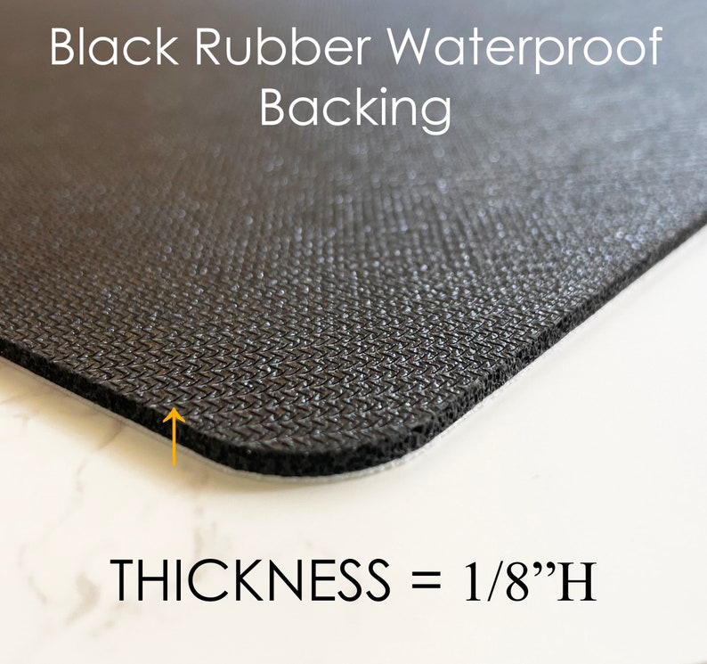 May include: Close-up of a black rubber waterproof backing with a textured surface. The thickness is 1/8"H. The text "Black Rubber Waterproof Backing" and "THICKNESS = 1/8"H" are displayed in white.