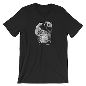 May include: Black t-shirt with a grayscale image of a rotary engine. The engine is shown in cross-section, revealing the internal workings.