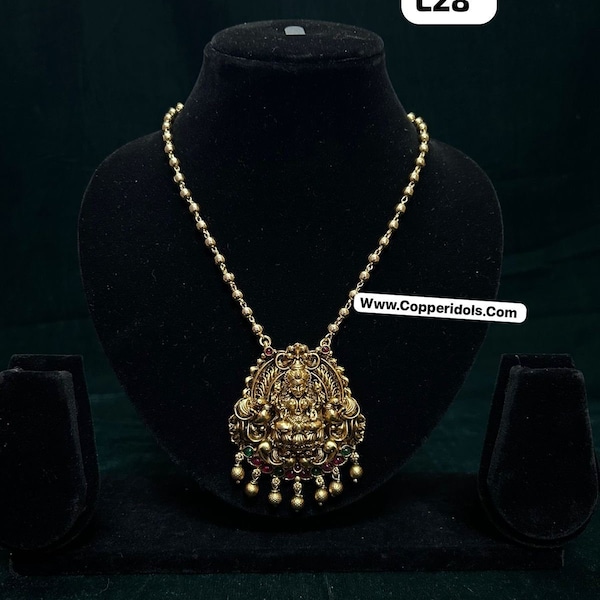 Panchaloha made gold polished lakshmi nakas pendant with gundu mala along with gem stone studded lakshmi gumkas