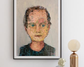 May include: A framed painting of a person's face. The person has blue eyes and is wearing a dark blue shirt. The painting is done in a textured style with visible brushstrokes.