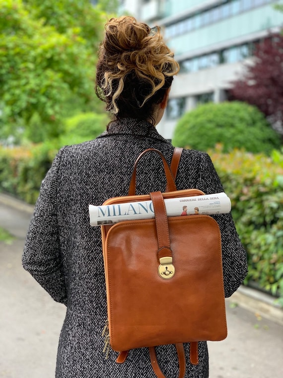 Refinished the leather on my vintage Louis Vuitton Alma bag and hand  painted it with a red-pink that I am in LOVE with. Covered all the stains  and scuffs and looks brand