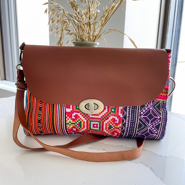 Leather and embroidered crossbody clutch, variety of Hmong fabric, Patchwork, adjustable straps, removable straps