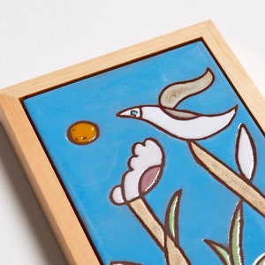 The vivid colors of the bird are sure to bring a splash of life and cheer to any room, while the delicate details make it a timeless piece that will never go out of style. This bird painting can create a peaceful atmosphere in any home.