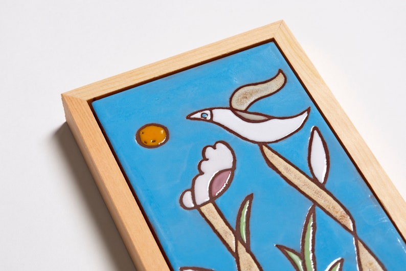 The vivid colors of the bird are sure to bring a splash of life and cheer to any room, while the delicate details make it a timeless piece that will never go out of style. This bird painting can create a peaceful atmosphere in any home.