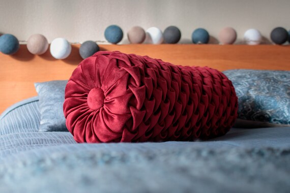 red bolster cushion
