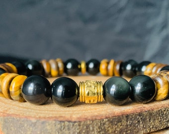 May include: A black and gold beaded bracelet with tiger's eye and black obsidian beads.