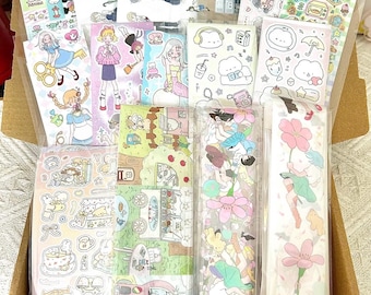 May include: A box filled with various colorful sticker sheets featuring cartoon characters, food, and floral designs. The stickers are packaged in clear plastic sleeves.