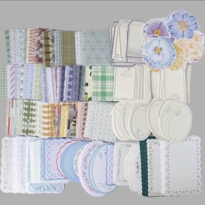 May include: A collection of decorative paper items, including patterned sheets, tags, and stickers. The sheets feature various designs, such as floral, plaid, and geometric patterns. The color palette includes pastel shades of blue, green, pink, and white, with floral stickers.