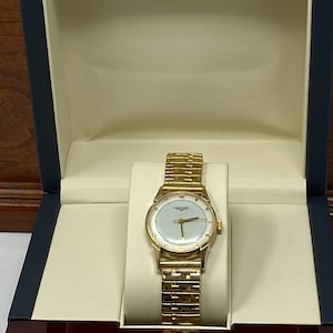 Vintage Boxed  14Kt Gold LONGINES Working Wristwatch with a Professional 2550.00 appraisal.
