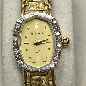 Vintages Boxed Working Birks 14Kt Gold and Diamond Quartz Watch on 14Kt Gold Bracelet with a Professional 3000.00 appraisal.
