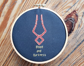 Blood and Darkness, Hades, completed cross stitch, framed in 6 inch hoop