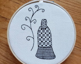 Cloaked figure, blackwork, completed cross stitch, framed in 5 inch hoop