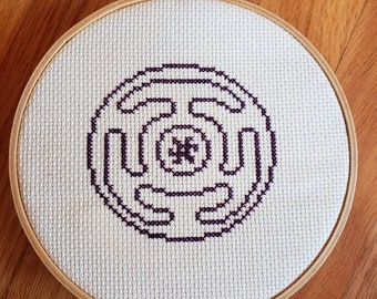 Hekate's Wheel completed cross stitch, framed in 6 inch hoop