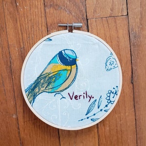 Verily. bird completed embroidery, framed in 5 inch hoop