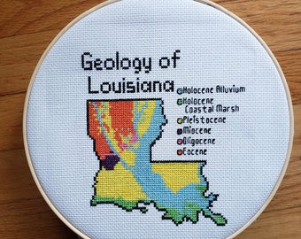 Louisiana Bedrock Geology completed cross stitch, framed in 9 inch hoop