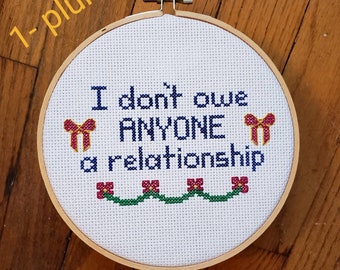 No Owed Relationships completed cross stitch, framed in 5 inch hoop