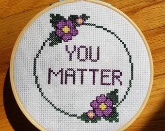 you matter completed cross stitch, framed in 5 inch hoop