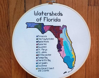 Florida Watersheds completed cross stitch, framed in 10 inch hoop