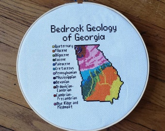 Georgia Bedrock Geology completed cross stitch, framed in 10 inch hoop